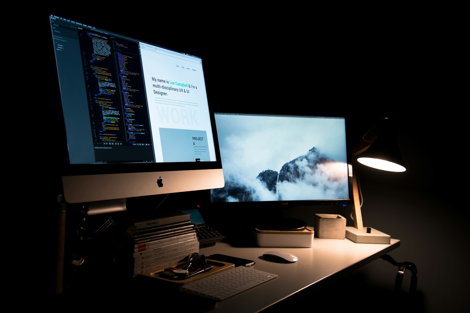 A web design workspace with sketches and a laptop